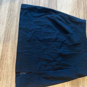 Short black pencil skirt with small slit